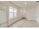 Bright living room with tile floors, a large mirror, and a window for natural light at 2321 Tay Wes Dr, St Cloud, FL 34771