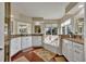 Well-lit bathroom featuring double vanity sinks, granite countertops, and a separate tub at 248 Isle Of Sky Cir, Orlando, FL 32828