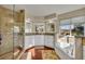 Bright bathroom featuring granite countertops, separate tub, and a tiled shower at 248 Isle Of Sky Cir, Orlando, FL 32828