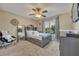 Cozy bedroom featuring a bed with storage, a window, and a large mirror at 248 Isle Of Sky Cir, Orlando, FL 32828