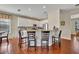 Kitchen with white cabinets, granite countertops, and barstool seating at 248 Isle Of Sky Cir, Orlando, FL 32828