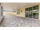 Spacious screened patio with stone pavers, providing an ideal outdoor living and entertaining space at 2797 Monticello Way, Kissimmee, FL 34741