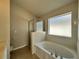 Large soaking tub and glass shower in a well-lit bathroom at 2932 Trema Ave, Winter Haven, FL 33881