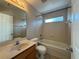 Bathroom with tub/shower combination and single sink vanity at 2932 Trema Ave, Winter Haven, FL 33881