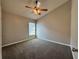 A cozy bedroom featuring a ceiling fan and a window for natural light at 2932 Trema Ave, Winter Haven, FL 33881