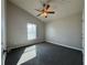 Bright bedroom with vaulted ceilings, ceiling fan, and plush carpeting at 2932 Trema Ave, Winter Haven, FL 33881