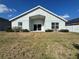 Charming home exterior with a well-manicured front yard and a covered entry at 2932 Trema Ave, Winter Haven, FL 33881