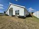 A side view of the property, showing the landscaped yard and architectural details at 2932 Trema Ave, Winter Haven, FL 33881