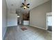 Spacious living room featuring tile floors, ceiling fan, and seamless transition to other areas at 2932 Trema Ave, Winter Haven, FL 33881