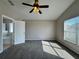 This main bedroom has neutral walls, large windows, and a ceiling fan at 2932 Trema Ave, Winter Haven, FL 33881