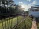 The black iron fence borders a greenbelt that runs along the backyard at 322 N Shadowbay Blvd, Longwood, FL 32779
