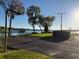Outdoor basketball court with waterfront views, blending recreation and scenic beauty at 322 N Shadowbay Blvd, Longwood, FL 32779