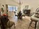 Cozy dining area featuring tile floors, a fireplace, and a sliding glass door to the outside at 322 N Shadowbay Blvd, Longwood, FL 32779