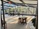 An indoor outdoor enclosed patio with plenty of space and relaxing seating arrangements at 322 N Shadowbay Blvd, Longwood, FL 32779