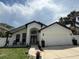 Well-maintained single-Gathering home featuring a 2-car garage and a beautifully landscaped front yard at 322 N Shadowbay Blvd, Longwood, FL 32779