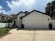 Single-Gathering home featuring a 2-car garage and a beautifully landscaped front yard at 322 N Shadowbay Blvd, Longwood, FL 32779