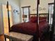 Beautiful main bedroom featuring a four-poster bed, bench, and two large windows at 322 N Shadowbay Blvd, Longwood, FL 32779