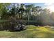 Picturesque pond surrounded by mature trees, creating a peaceful and private setting at 322 N Shadowbay Blvd, Longwood, FL 32779