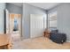 Cozy bedroom with a closet, neutral carpet, and blue walls, with a view of another room at 323 Villa Sorrento Cir, Haines City, FL 33844