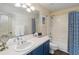 Bathroom featuring a vanity with double sinks and shower and tub at 3262 Amaca Cir, Orlando, FL 32837