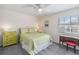 Bedroom featuring a window, ceiling fan, and furniture at 3262 Amaca Cir, Orlando, FL 32837