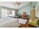 Tranquil main bedroom with wood floors, a comfortable bed, and a window view of the pool at 3262 Amaca Cir, Orlando, FL 32837