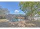 Exterior view of a screened-in pool and patio in a spacious backyard at 328 Bridle Path, Casselberry, FL 32707