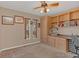 Bedroom featuring built-in wooden cabinets and shelving, a ceiling fan, and carpeted flooring at 328 Bridle Path, Casselberry, FL 32707