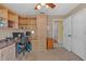 Bedroom featuring built-in wooden cabinets and shelving, a ceiling fan, and carpeted flooring at 328 Bridle Path, Casselberry, FL 32707