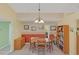 Cozy dining room with a wooden table, chairs, and a decorative chandelier fixture at 328 Bridle Path, Casselberry, FL 32707