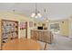 Bright living room showcasing a pool view, wooden cabinets, and comfortable seating at 328 Bridle Path, Casselberry, FL 32707