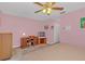 Comfortable main bedroom with ceiling fan, closet, and ensuite bathroom at 328 Bridle Path, Casselberry, FL 32707