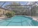 Inviting screened-in pool area with sparkling water and serene backyard views at 328 Bridle Path, Casselberry, FL 32707