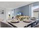 Beautiful dining room featuring an elegant white table with seating for four, perfect for hosting intimate dinners at 3623 Marlbrry Way, Sanford, FL 32773