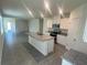 Modern kitchen with granite countertops, stainless steel appliances, and an island at 3623 Marlbrry Way, Sanford, FL 32773