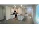 Open-concept kitchen featuring stainless steel appliances, gray tile floors, and a granite island at 3623 Marlbrry Way, Sanford, FL 32773