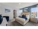 Inviting main bedroom with decorative blue accent wall, soft carpet, and natural lighting through the windows at 3623 Marlbrry Way, Sanford, FL 32773