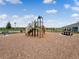 Community playground featuring a jungle gym, slide, picnic table, and shaded bench under a bright sky at 3623 Marlbrry Way, Sanford, FL 32773