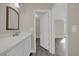 Modern bathroom featuring a vanity with stone countertop and views to other rooms at 3778 Martin St, Orlando, FL 32806