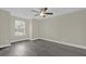 Bedroom featuring new wood-look floors and a bright, large window at 3778 Martin St, Orlando, FL 32806