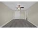 Bedroom with a ceiling fan, new floors, and a spacious closet at 3778 Martin St, Orlando, FL 32806