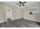 Open-concept living room featuring modern floors, neutral walls, and a ceiling fan at 3778 Martin St, Orlando, FL 32806