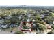 Beautiful home with a pool and tile roof surrounded by lush greenery, enhanced with red highlighting at 400 W Par St, Orlando, FL 32804