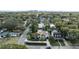 Aerial view of a neighborhood with lush landscaping, mature trees, and a glimpse of the city skyline at 400 W Par St, Orlando, FL 32804