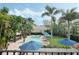 Lush backyard with a pool, cabana, lounge chairs, and vibrant landscaping at 400 W Par St, Orlando, FL 32804