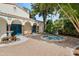 Picturesque courtyard showcasing a bubbling hot tub, decorative columns, and vibrant landscaping with an inviting ambiance at 400 W Par St, Orlando, FL 32804