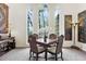 Formal dining room with large windows providing natural light and garden views at 400 W Par St, Orlando, FL 32804