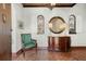 Beautiful foyer with unique architectural details, arched windows, and a vintage chair and dresser at 400 W Par St, Orlando, FL 32804