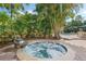 Inviting hot tub surrounded by lush greenery and a stone water feature, providing a relaxing outdoor oasis at 400 W Par St, Orlando, FL 32804