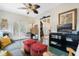 Inviting sitting room featuring colorful poufs and views into the formal living room at 400 W Par St, Orlando, FL 32804